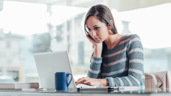 WELLIVER-woman-on-computer-in-blue-sweater-min.jpeg