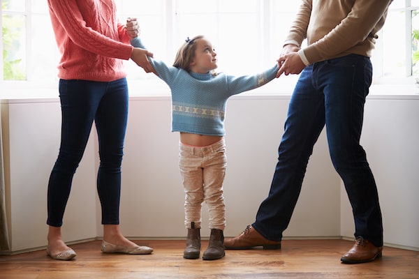 WELLIVER-parents-pullings-child-in-two-directions-min.jpeg