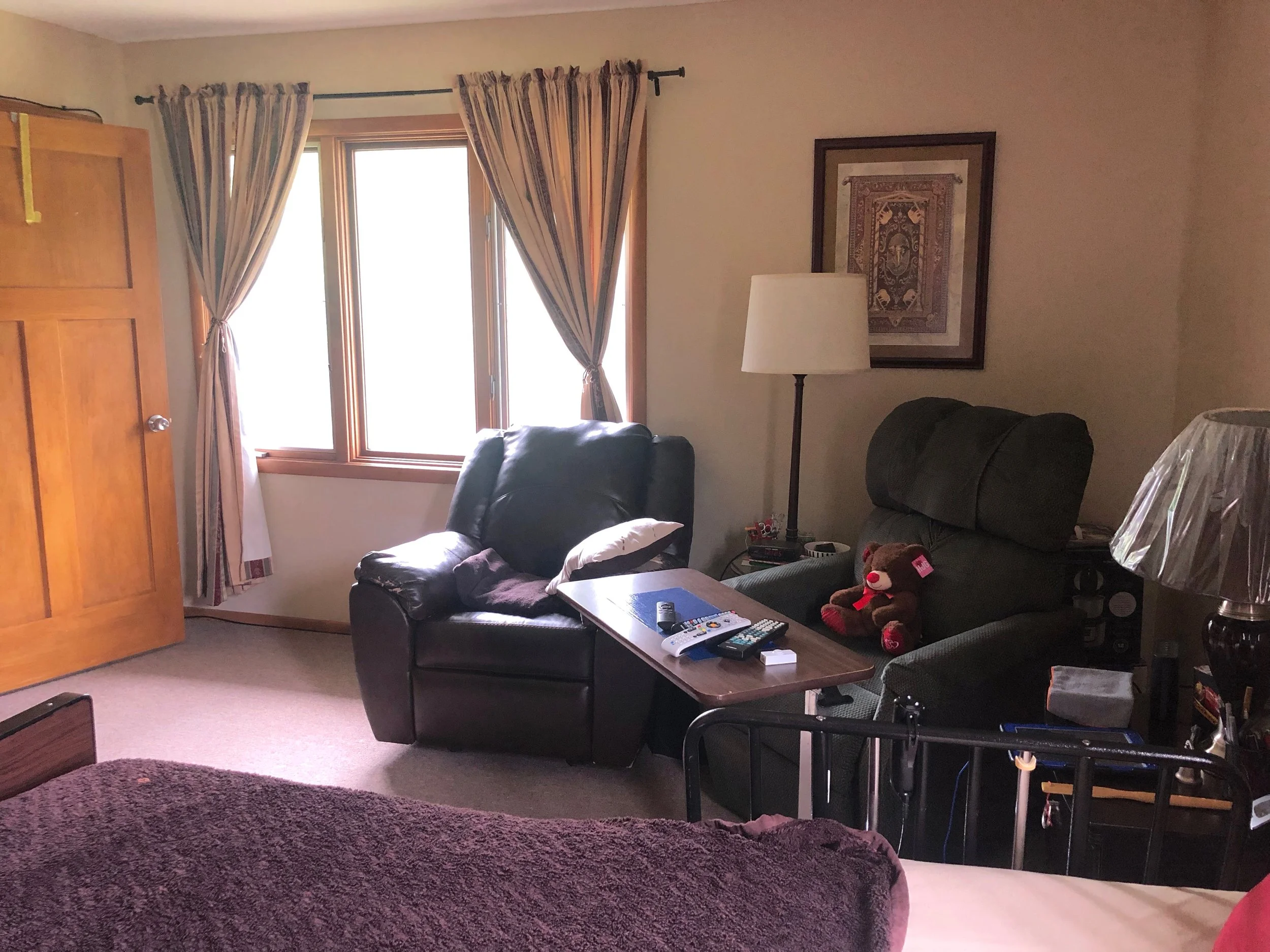 Bedroom with Two Chairs and Window