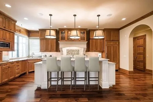 Butternut-paneled walls and walnut floors create a warm and cozy glow in this fabulous Lake Harriet listing. Built by Charles Cudd, this custom home showcases their finest work: a chef&rsquo;s kitchen with top-of-the-line everything! Unobstructed eas