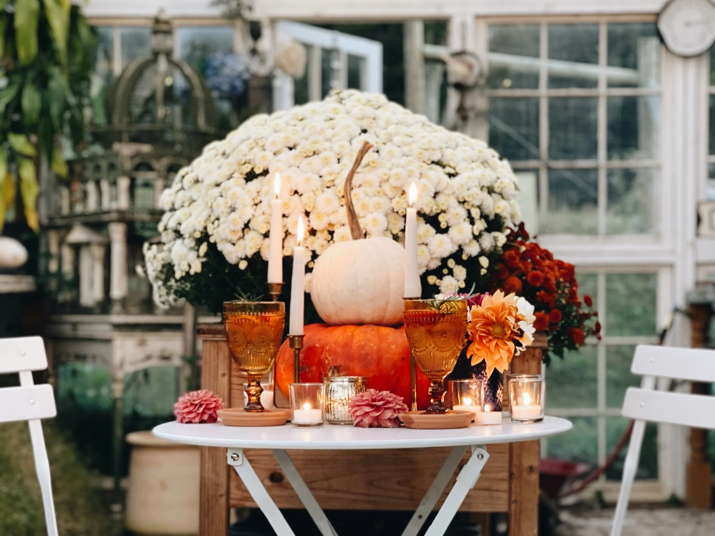 Candlelight and fall decorations in the greenhouse