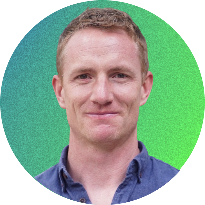 Portrait of a person in a blue shirt with a gradient green background.