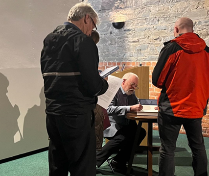 Dr Garry Bannister signing books