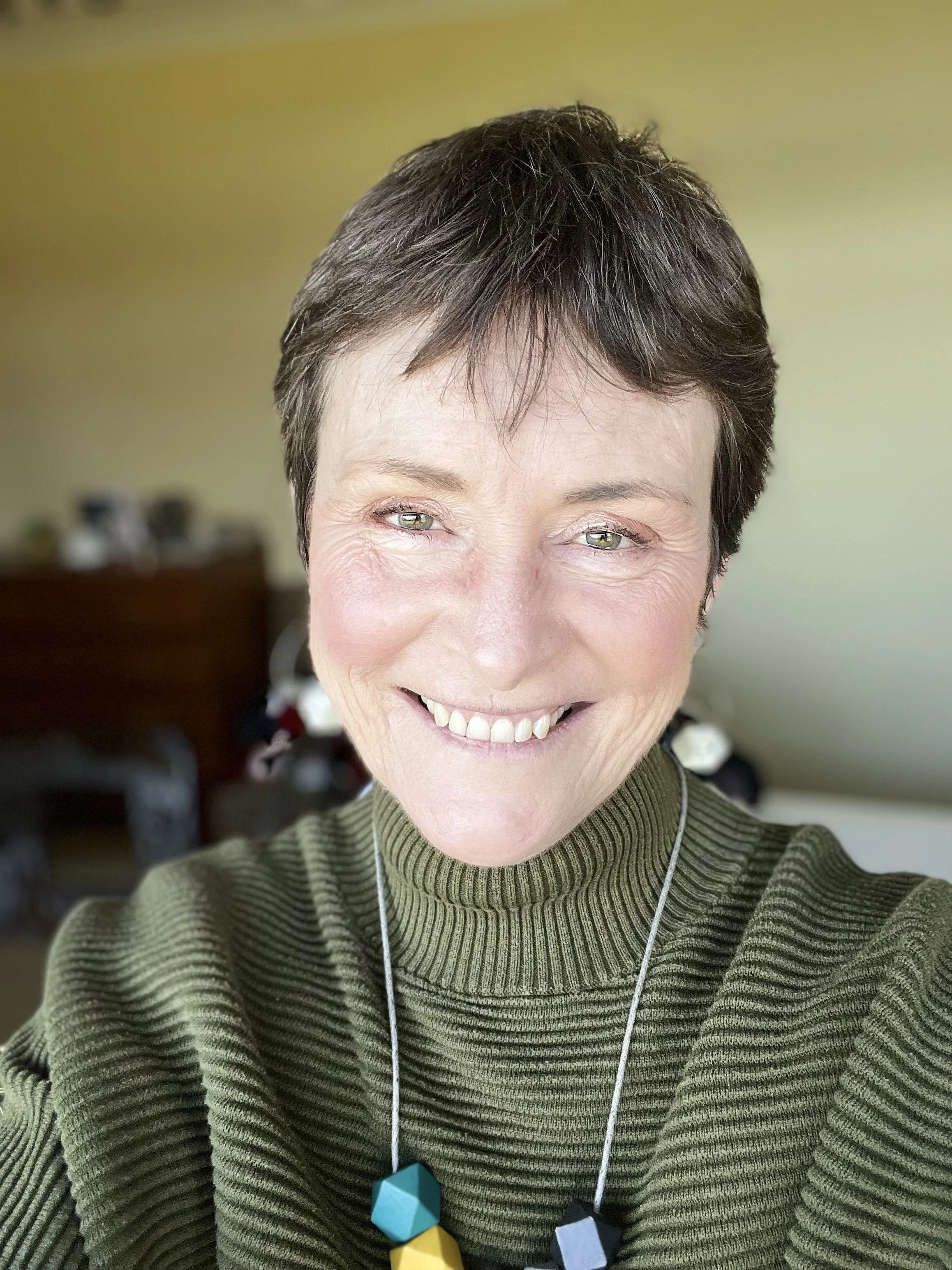 Carol Nunan printmaker in her garden studio on the Isle of Bute, Scotland