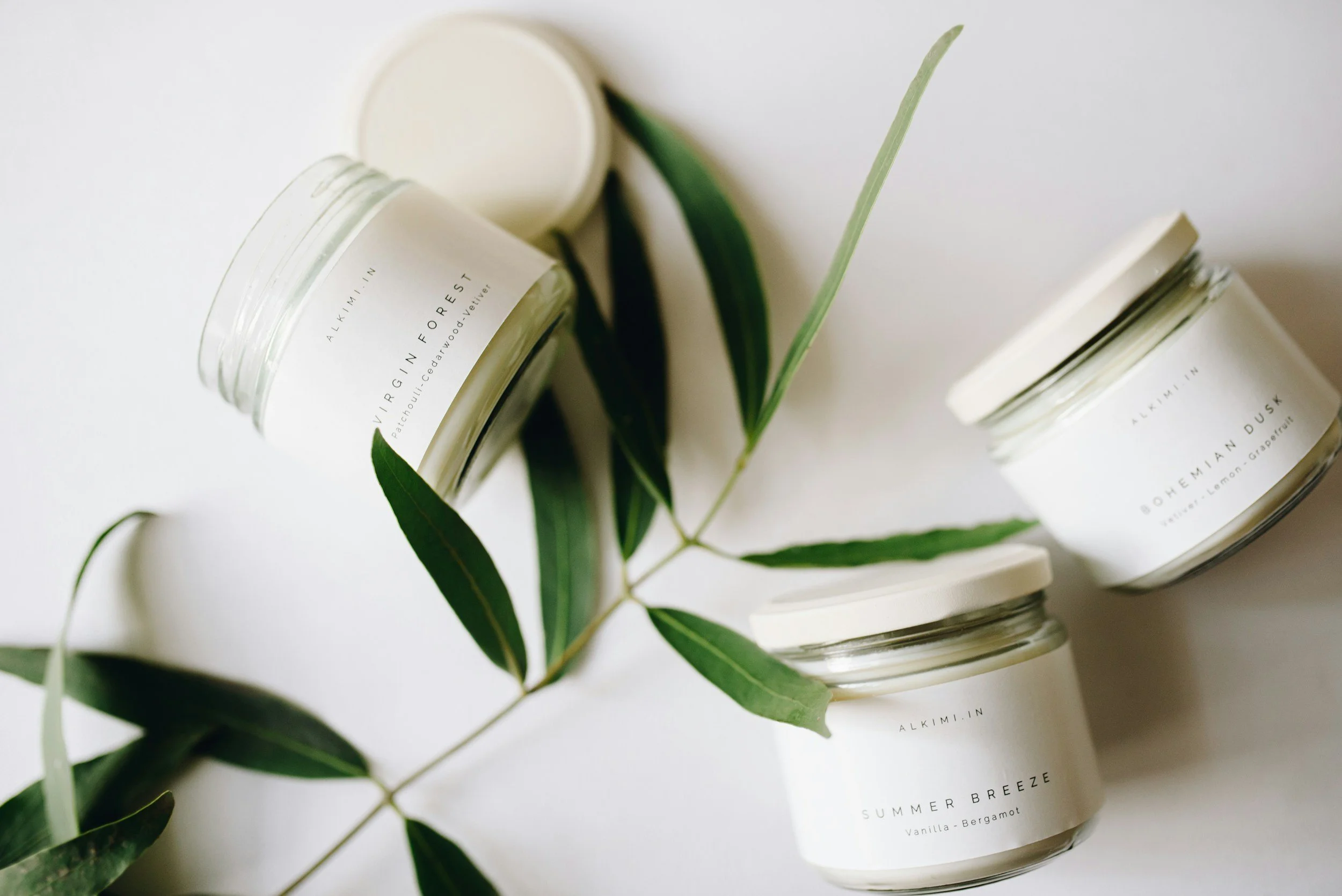 Handmade candles displayed in a styled photo