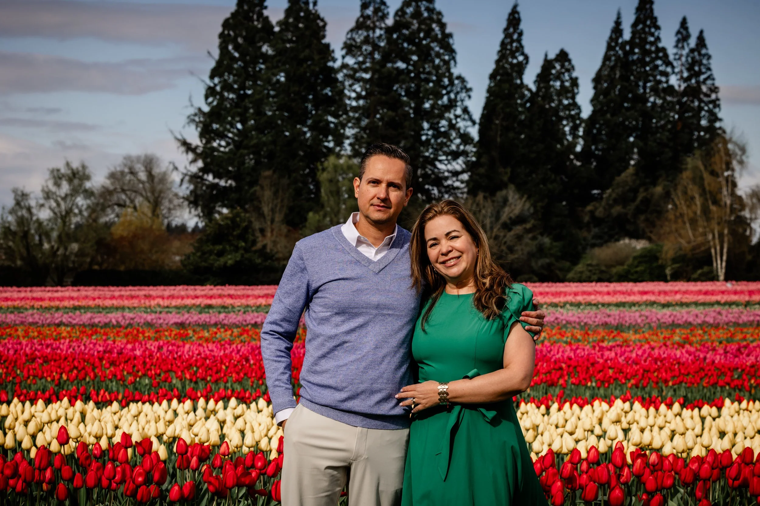 Family of 4 posing/laughing in colorful tulips at Wooden Shoe Farm,  professional family portrait by Studio 623 Photography