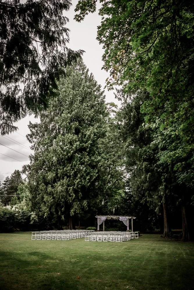 Tall cedars and the rustic log lodge at Cedarville Lodge in Gresham, Oregon