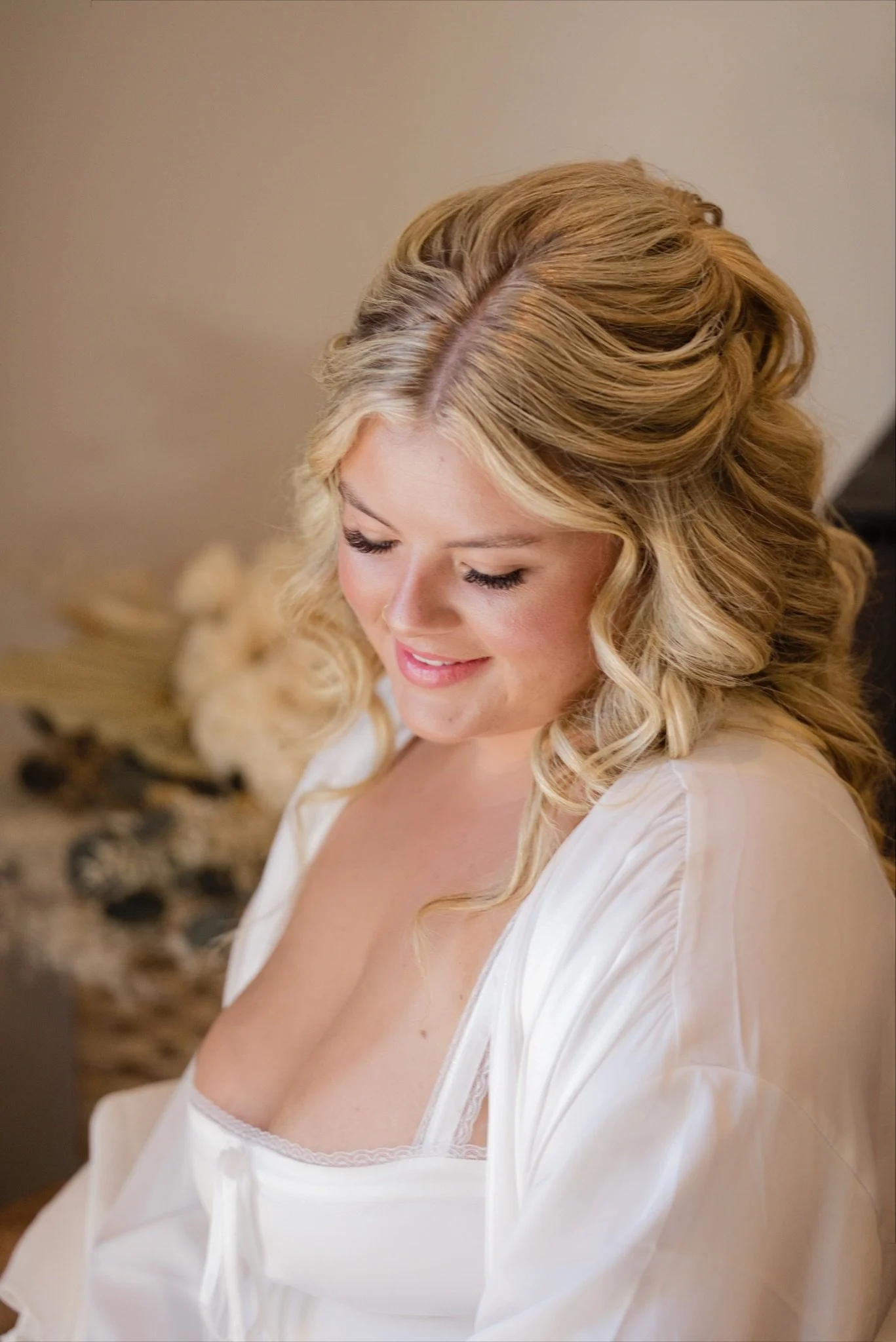 Sarah in her robe with her bouquet, bridal portrait in the window light