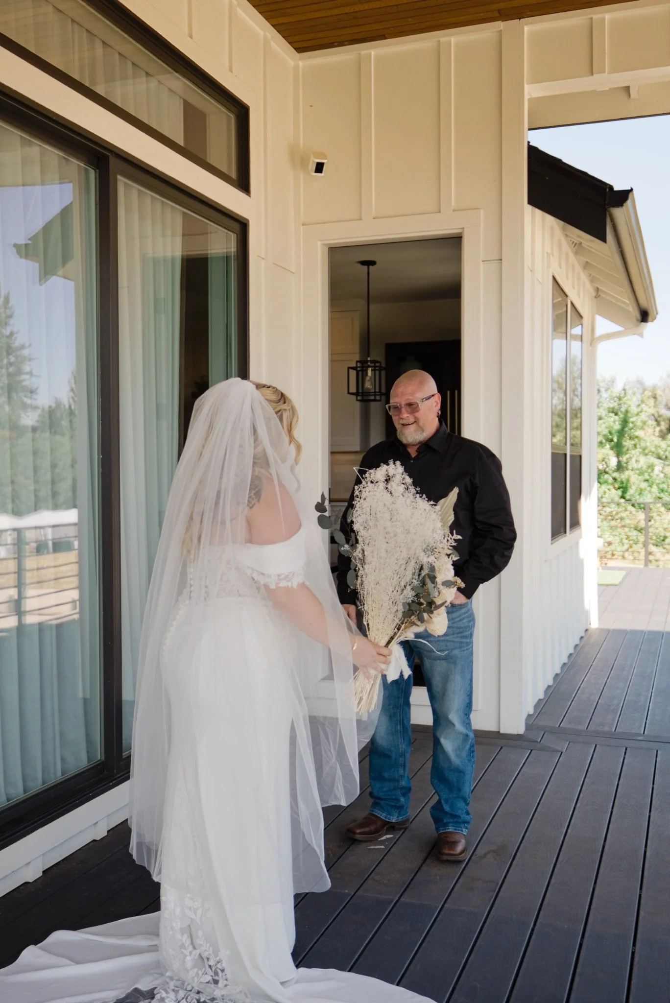 Sarah coming down the steps with her dad before the ceremony