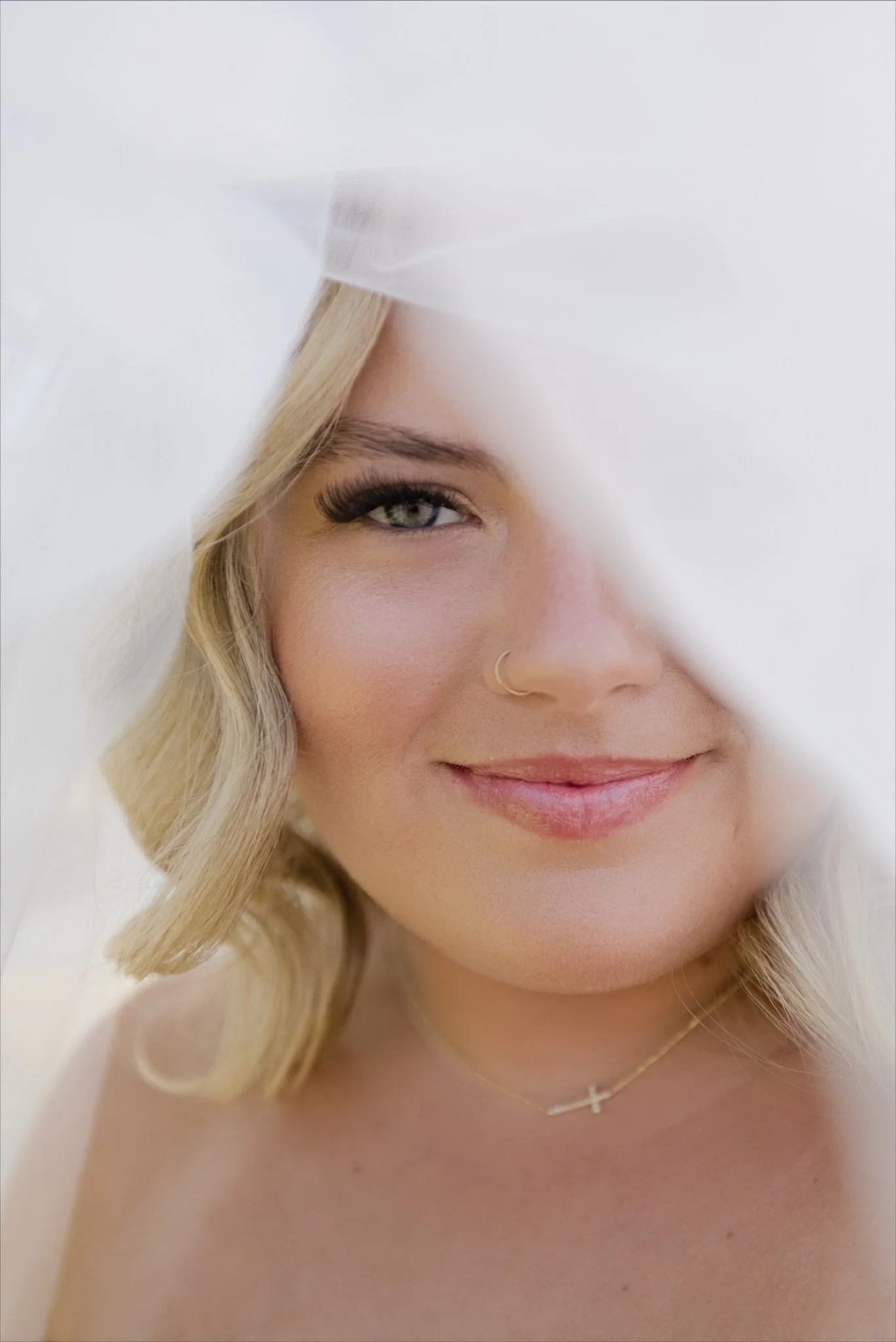 A soft portrait of Sarah through the sheer veil