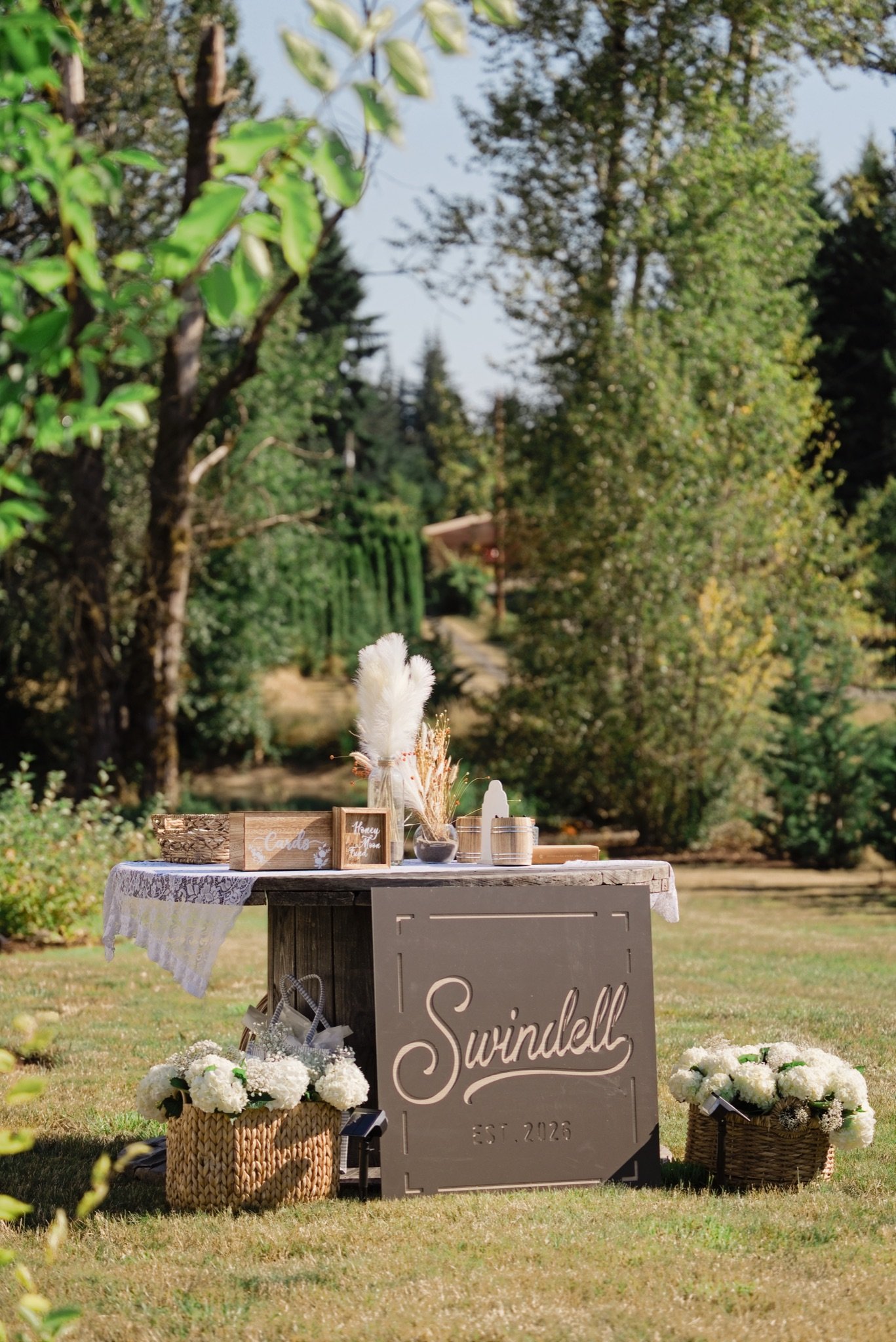 The welcome sign and dried florals in the meadow
