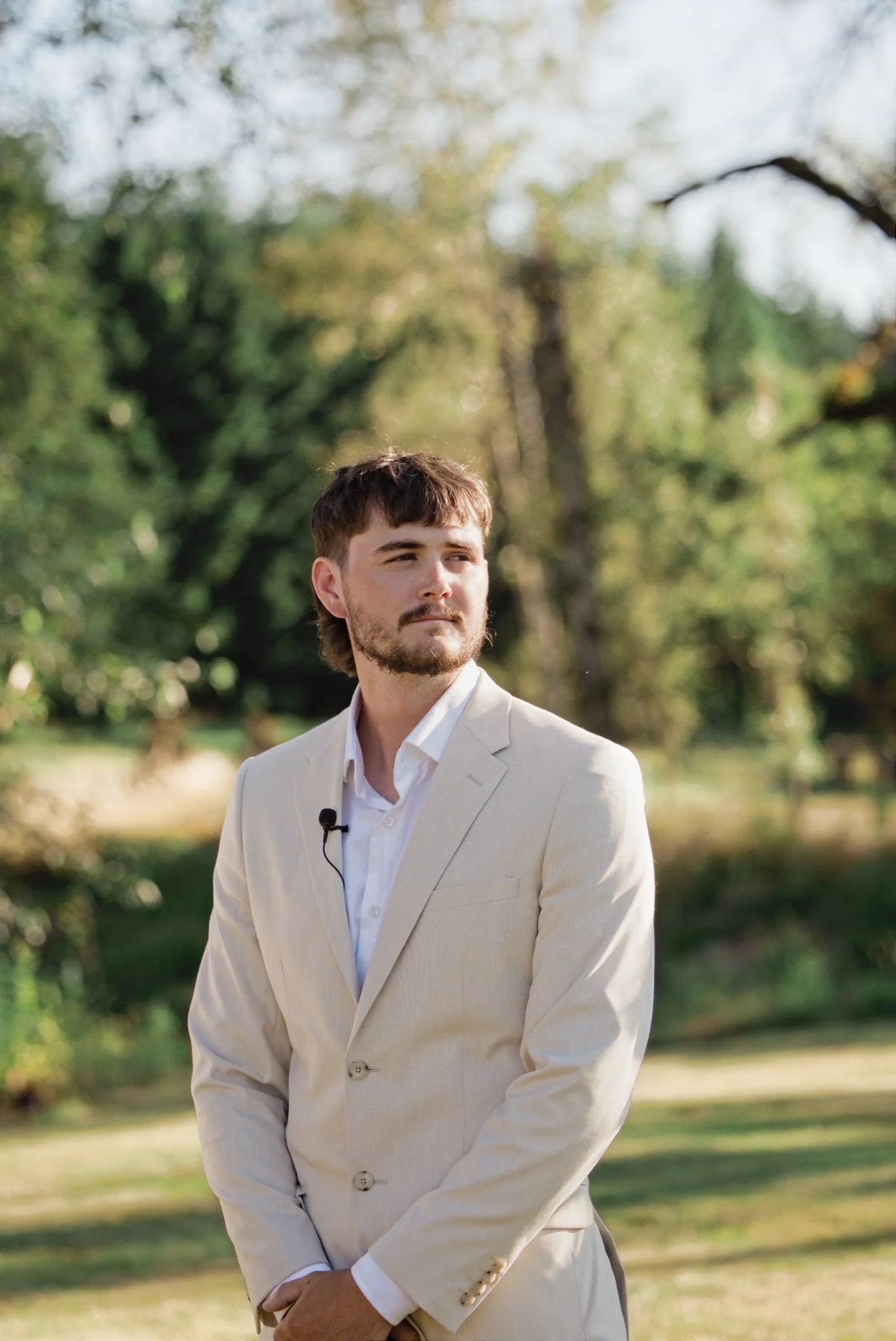 Reed in his cream suit waiting at the altar