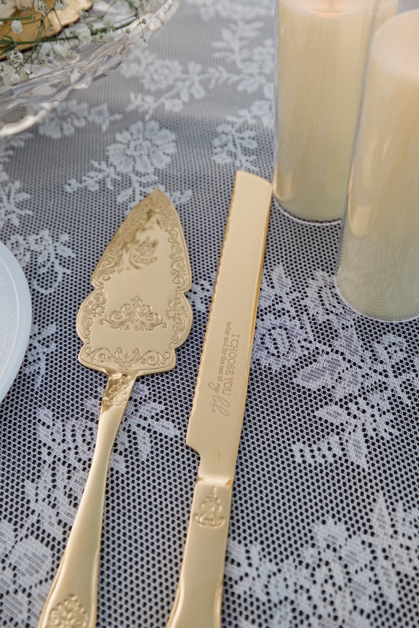 The cake knife and server on a lace tablecloth
