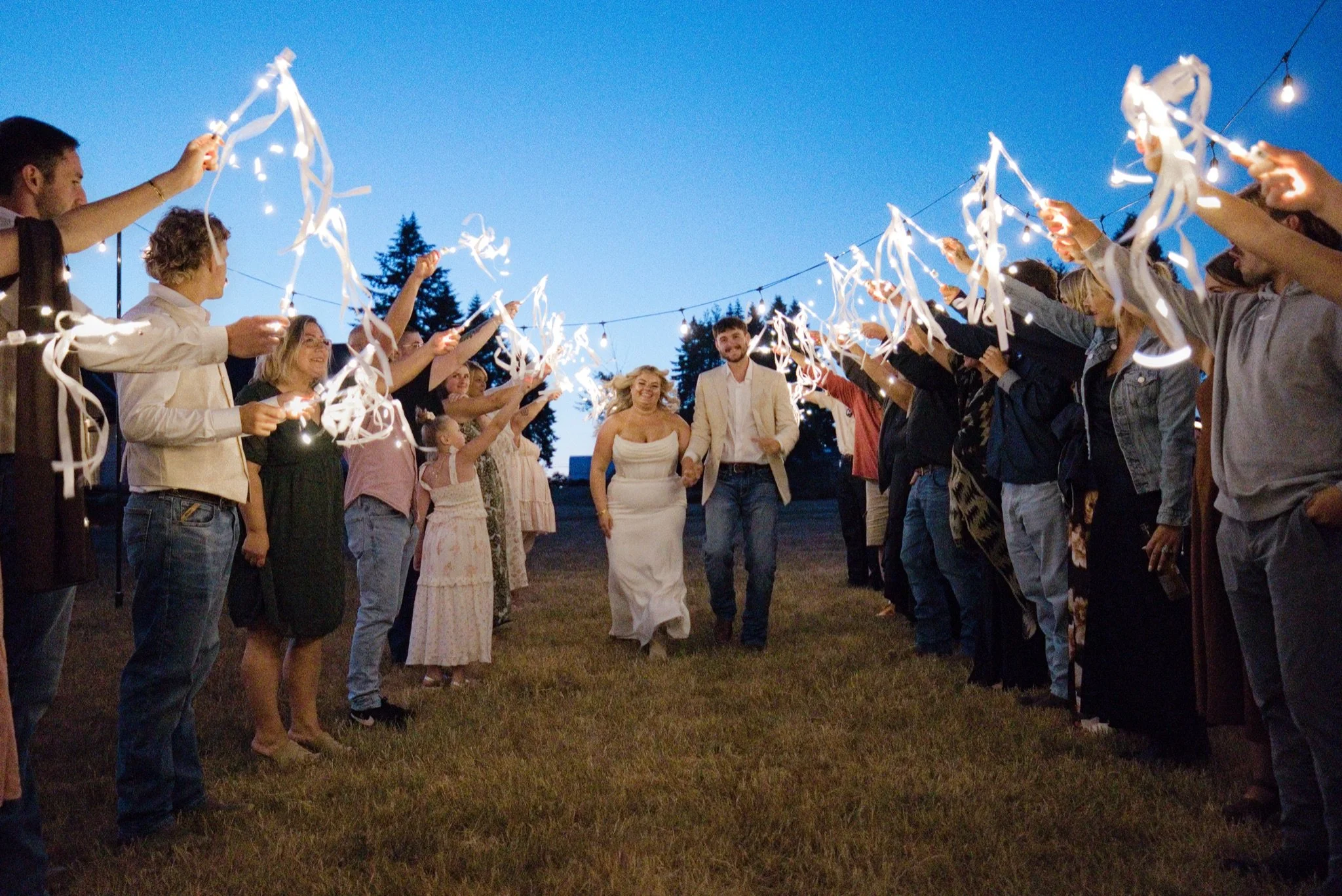 Guests waving ribbon wands for the send off