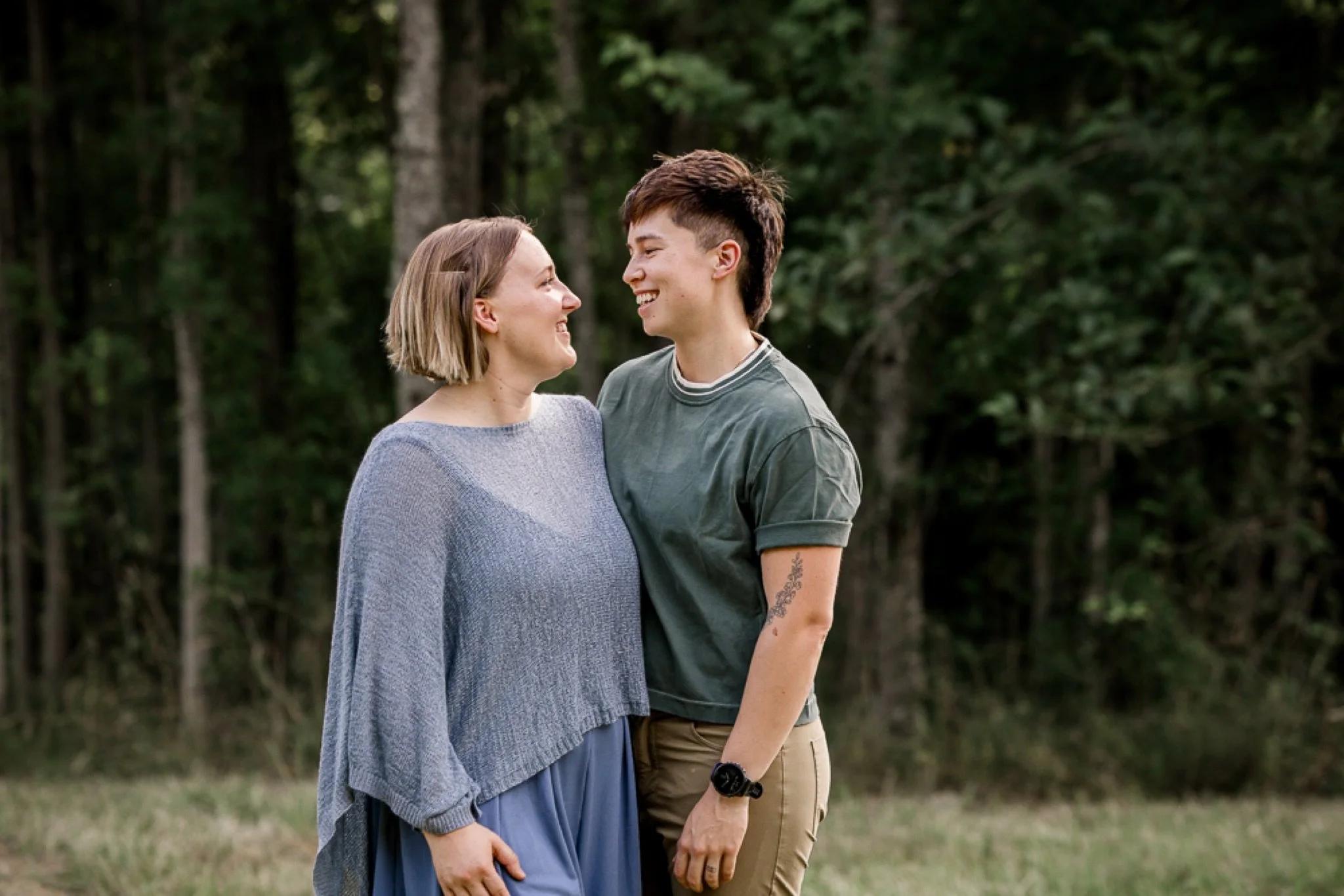 Mom and her son laughing together in the summer field