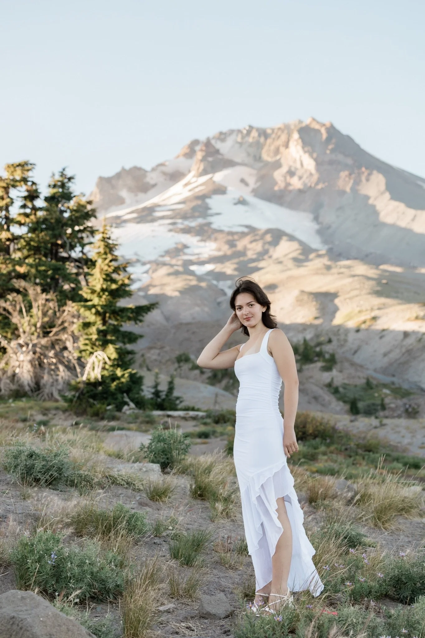 Hailey in a white dress with the peak of Mt Hood behind her