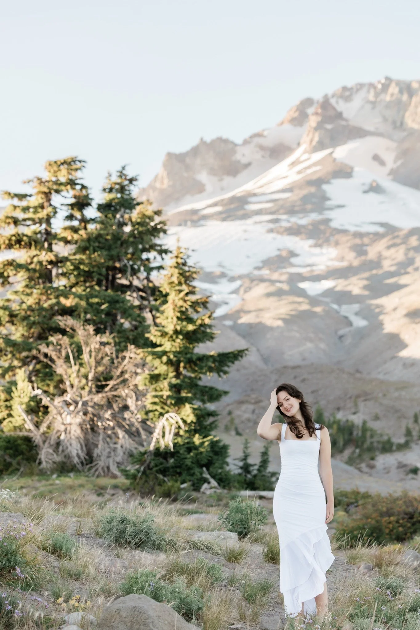 Hailey in the alpine meadow with Mt Hood rising behind the firs