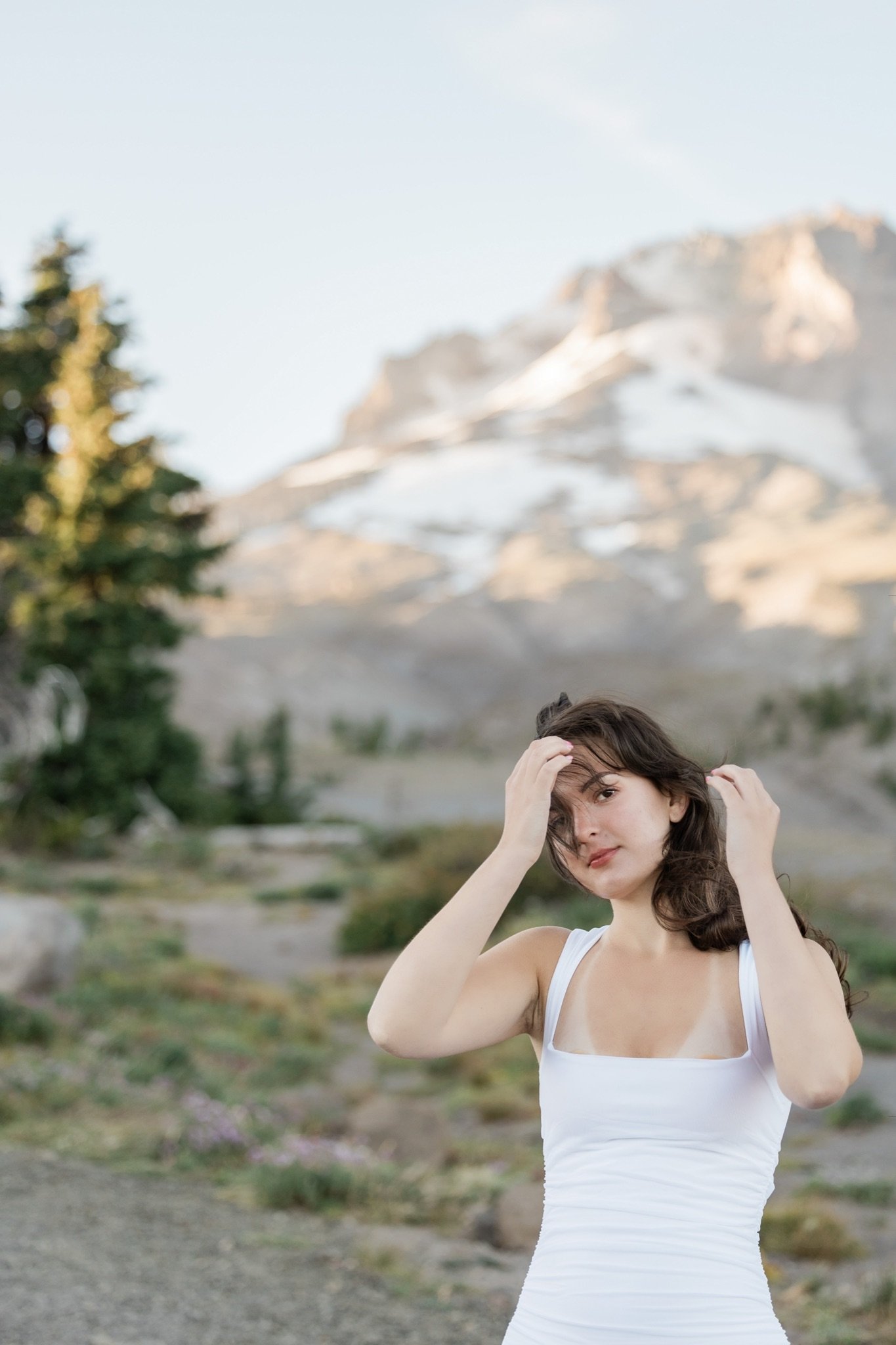 Hailey in white with the evening light on Mt Hood behind her