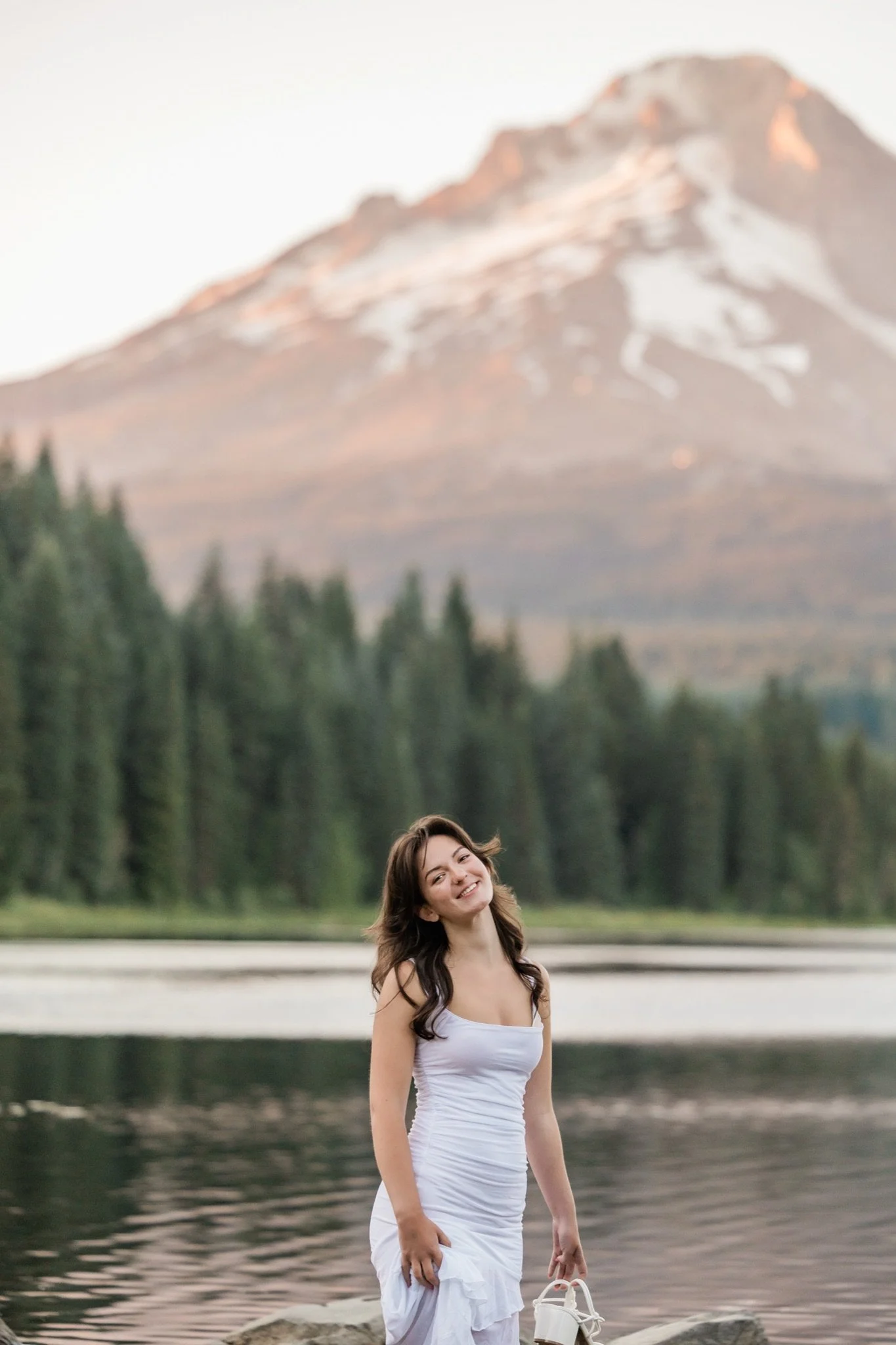 Hailey on the lakeshore with the alpenglow on Mt Hood
