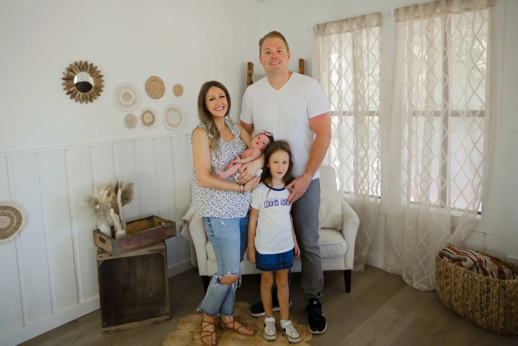 The family of four standing together in the studio, Portland newborn photographer