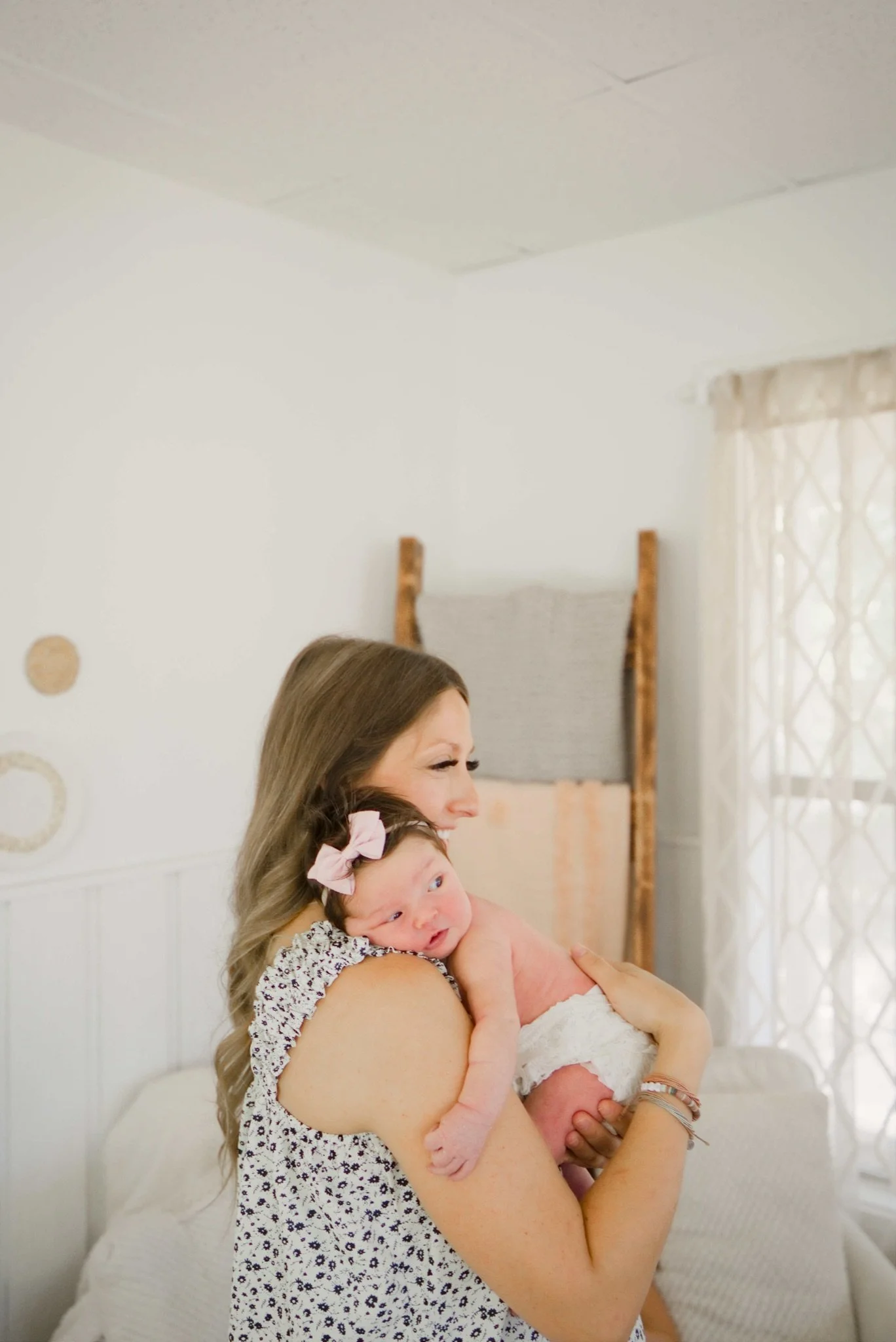 Mom cradling Stevie in the bright white studio