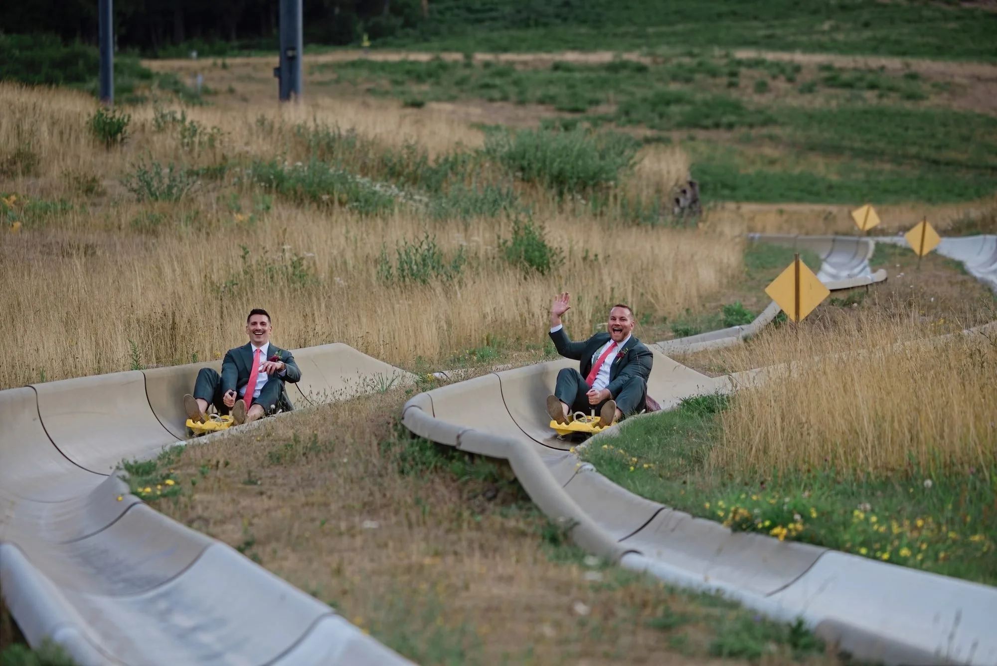 The grooms riding the alpine slide at Mt. Hood Skibowl on their wedding morning