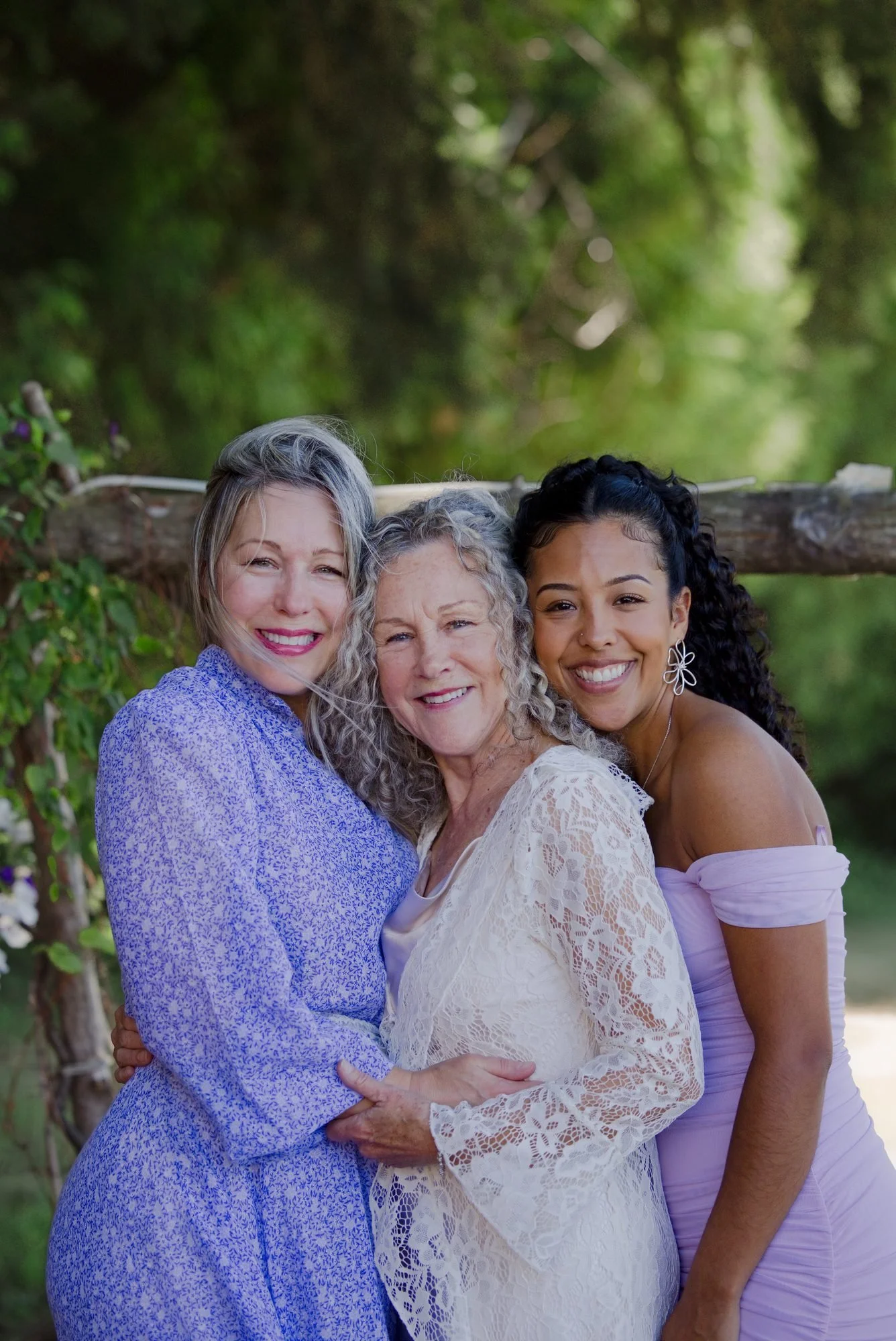 Trudy with two guests in lavender after the ceremony in the backyard