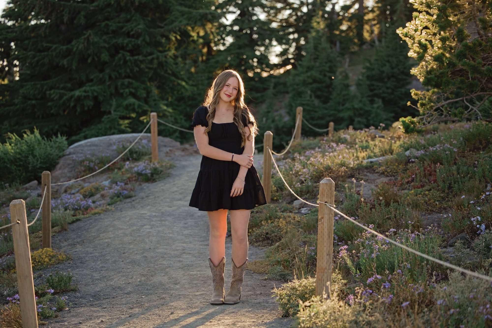 This senior walking the rope lined trail near Timberline with alpine wildflowers