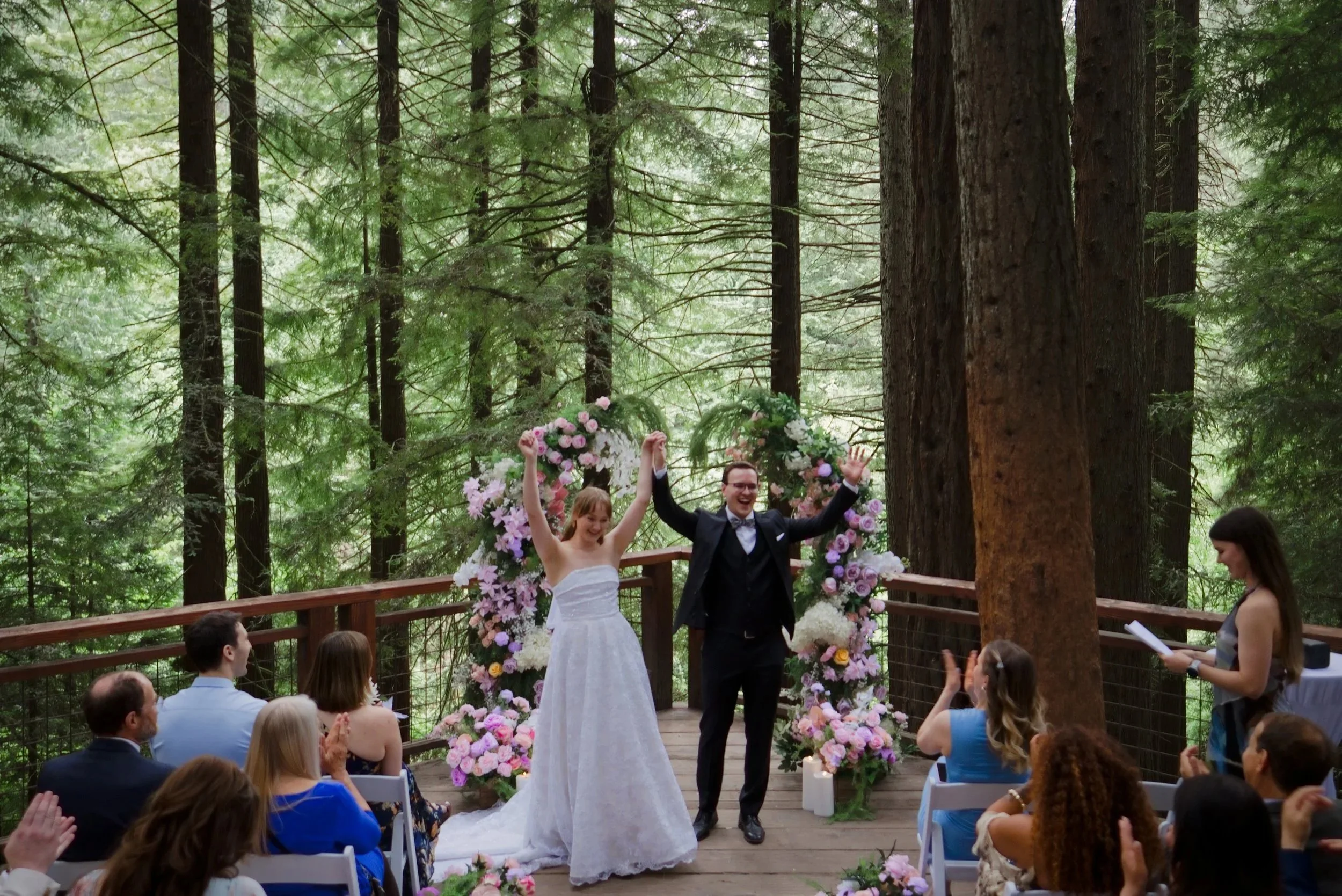 Bride and groom celebrating recessional at the Redwood Deck Hoyt Arboretum Portland Oregon elopement photographer