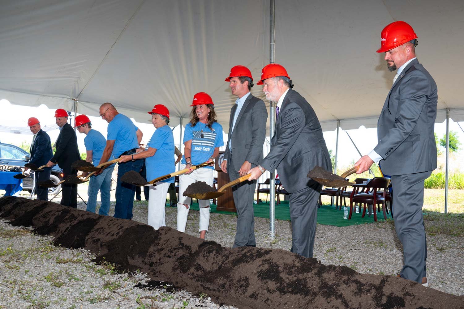  Using golden shovels, Gov. Andy Beshear, along with Jody Cash’s family and others, officially broke ground Monday morning. (Photo by Jim Robertson) 