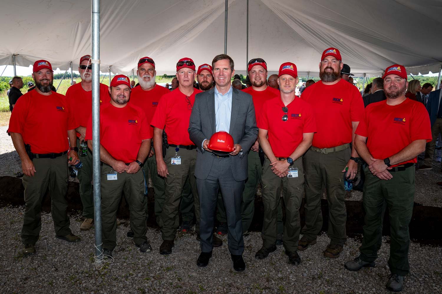  Gov. Andy Beshear posed with DOCJT firearms instructors following Monday’s groundbreaking ceremony. (Photo by Jim Robertson) 