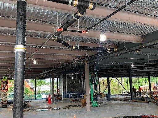  Interior framing began and MEP (Mechanical, Electrical, and Plumbing) overhead rough-in, with hangers going up on all levels 