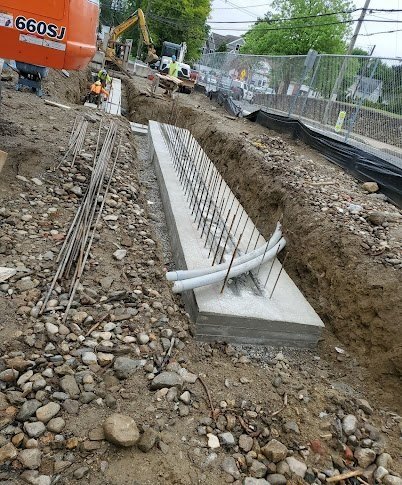  Concrete footings are installed for the exterior stone walls at the library’s main entrance on Maple Street 