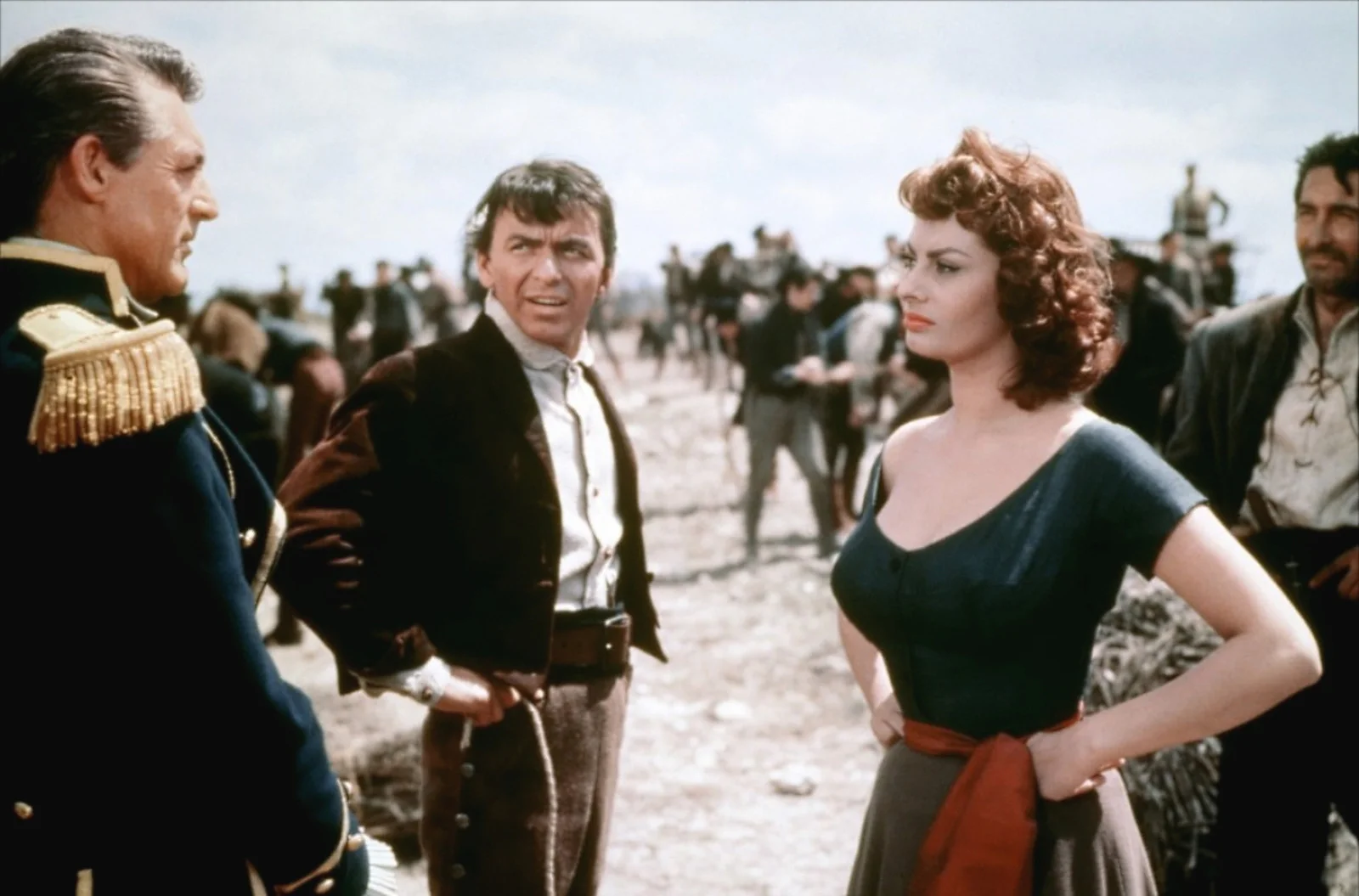 Loren in “The Gold of Naples” (1954, top) and “The Pride and the Passion” (1957, bottom) with Cary Grant and Frank Sinatra.
