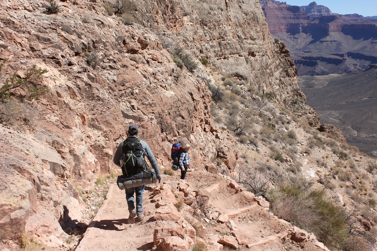 Jack and dad hiking to the bottom of the canyon