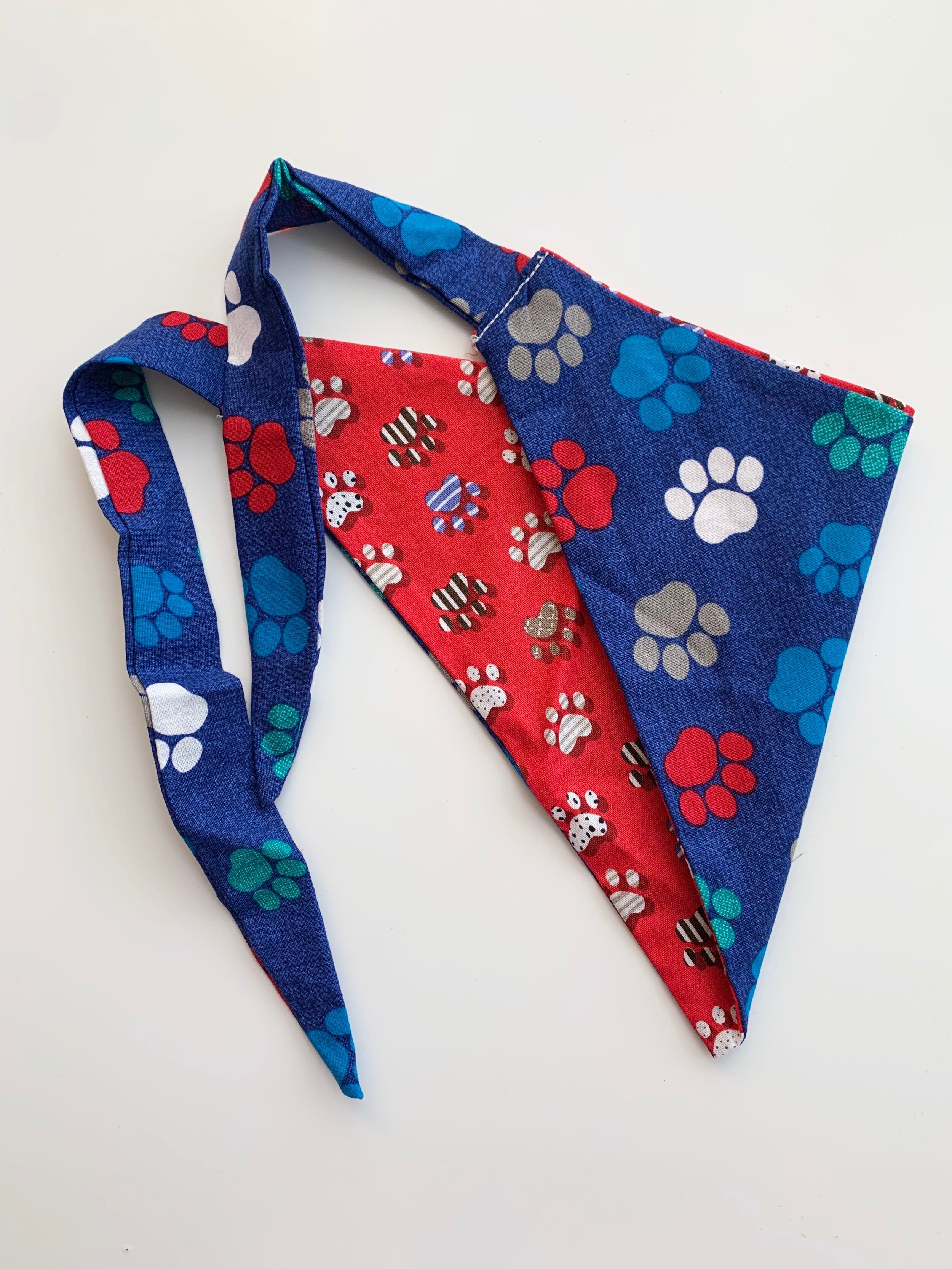 reversible dog bandana: navy dog paw/red dog paw
