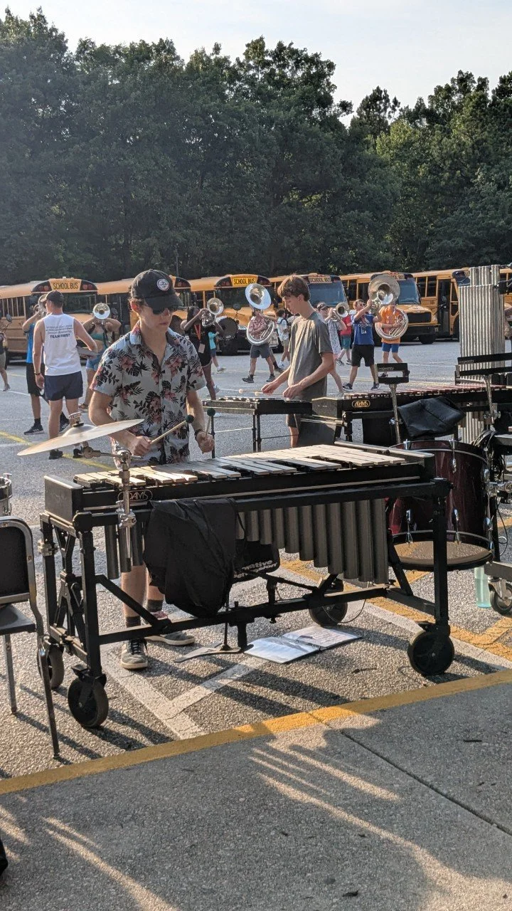 Geometric drawing of an outline square with sections divided by vertical, horizontal, and half circle lines.