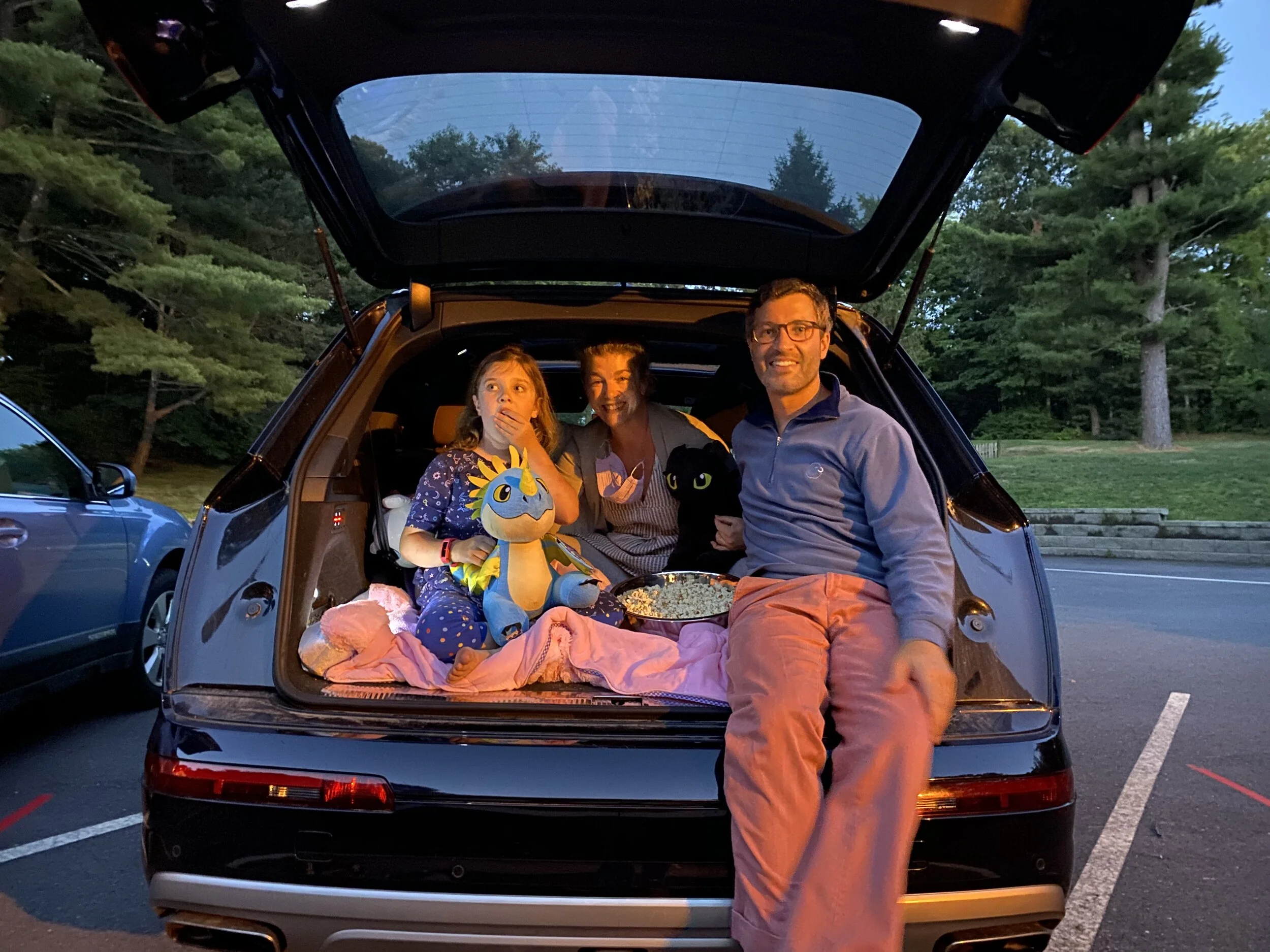 Enjoying a drive-in movie in the parking lot