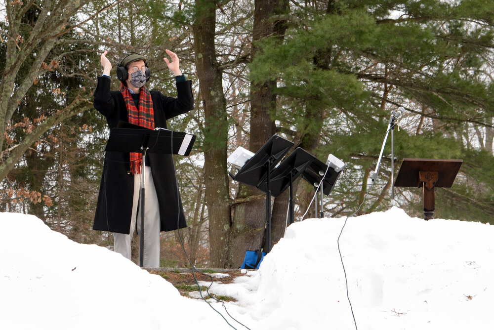 Music Director Jay Lane conducting the choir