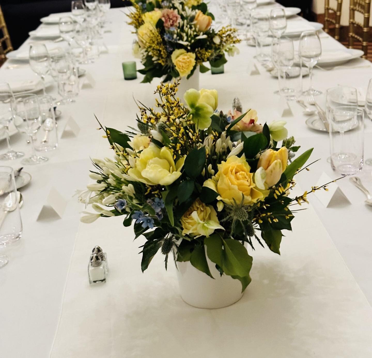 Our client chose rectangular tables instead of round for a business dinner last week.  A white linen runner over white cotton tablecloths kept everything simple and elegant.