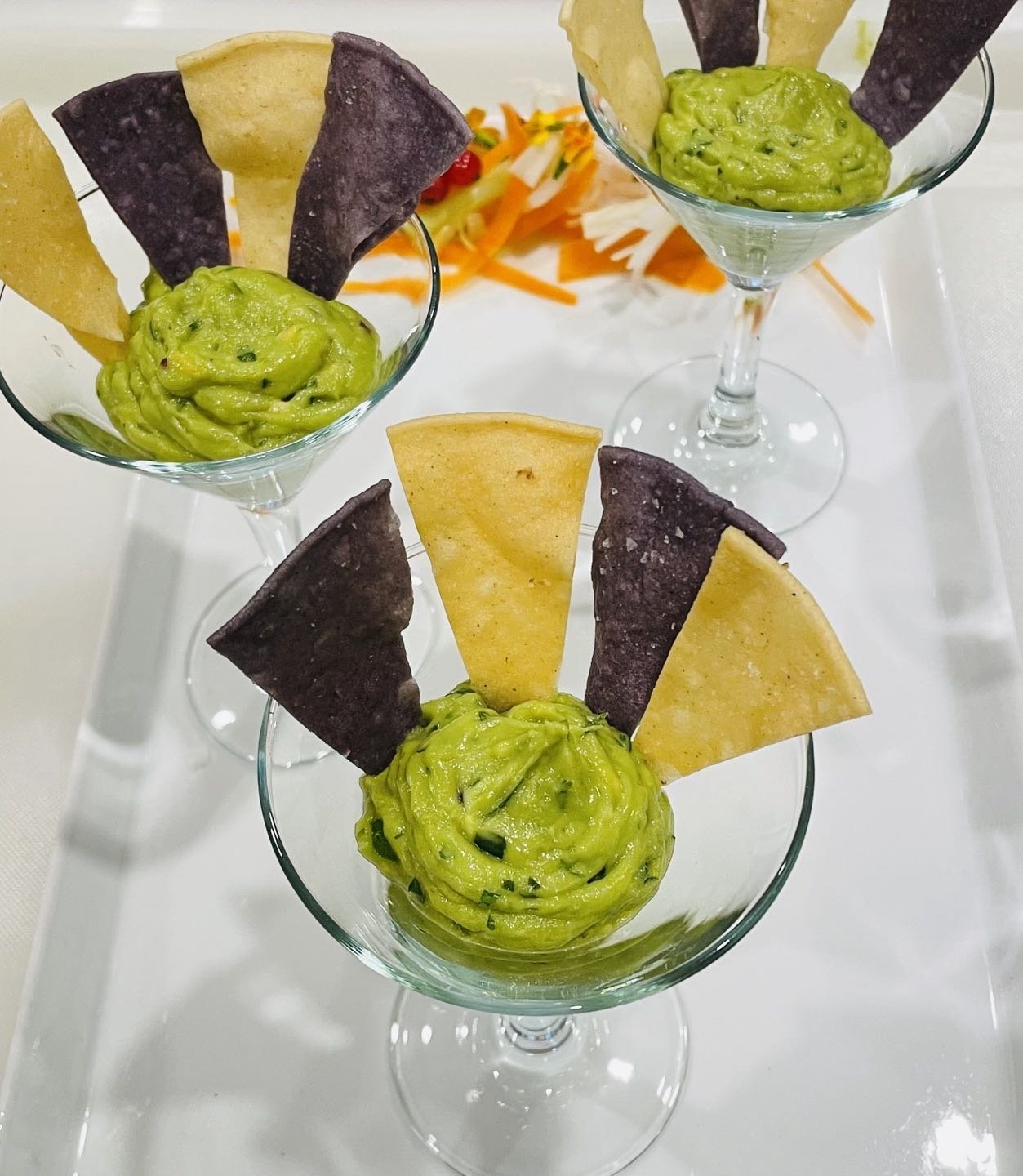 Guacamole and Home Fried Tortilla Chips in mini martini glasses.