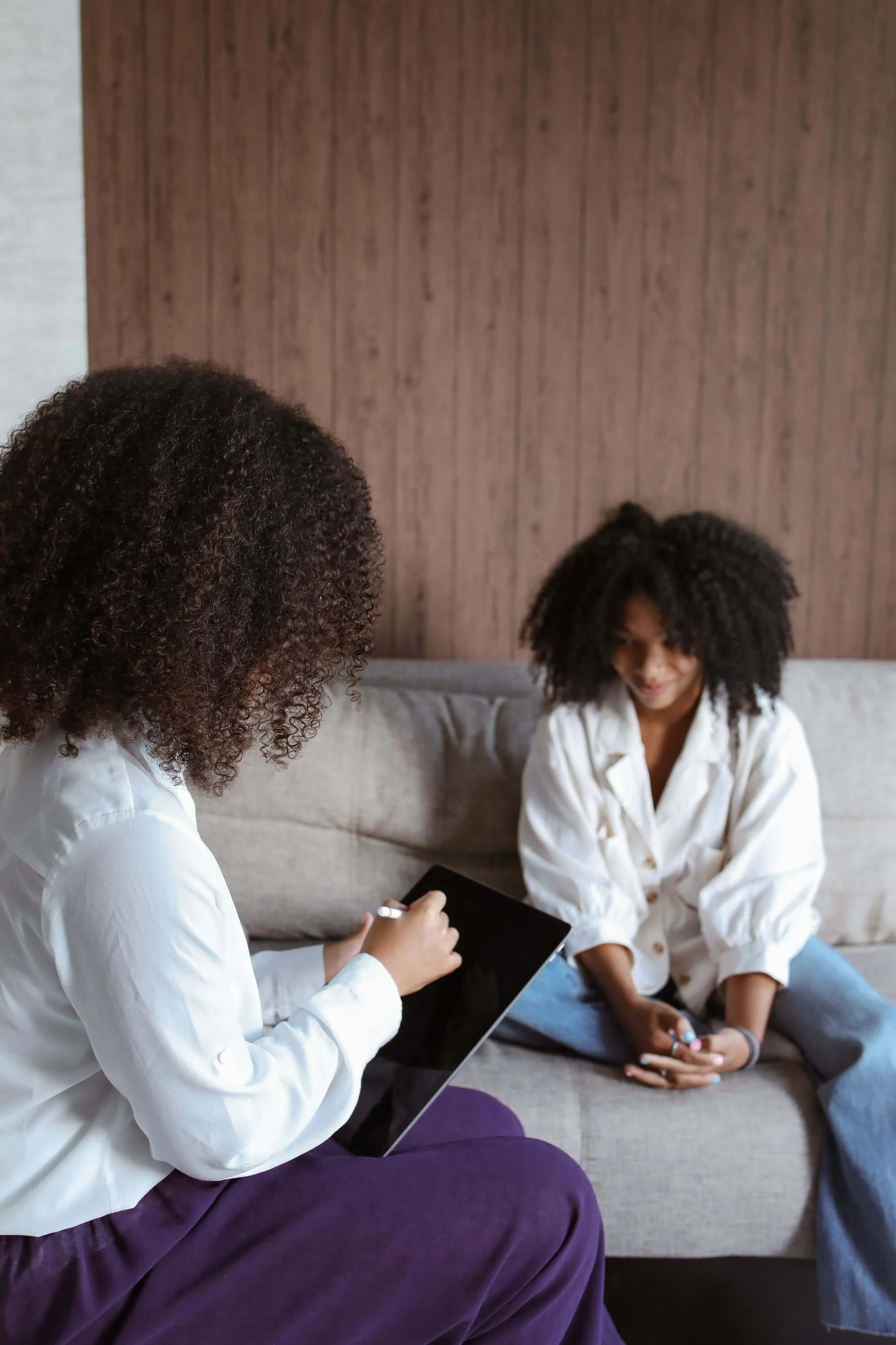A therapist sits across from a client in a warm therapy session, representing the focused, specialized support offered by an eating disorder therapist in Utah and a body image therapist in Salt Lake City, UT.