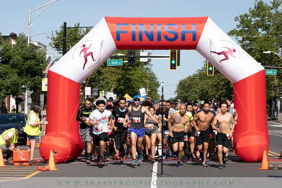 Photo of the start of the inaugural Running THE AVE 5K. Our flagship race