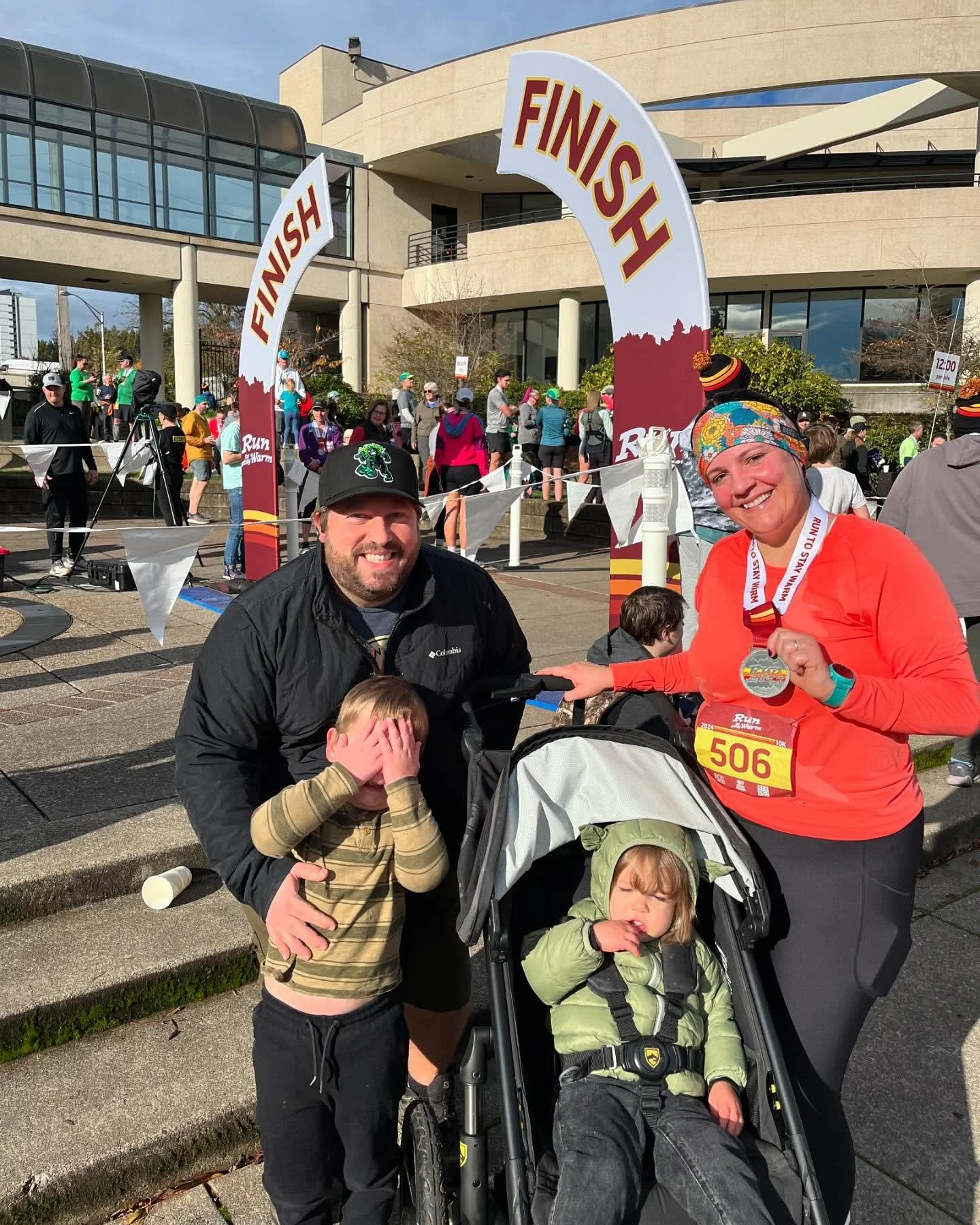 Mother winning medal at marathon