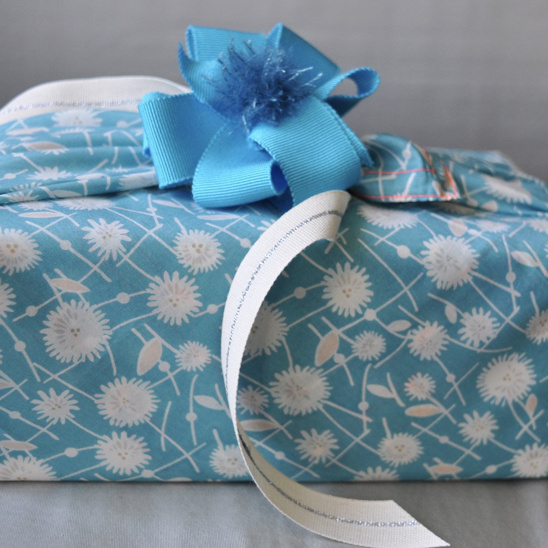 Dandelion fabric gift wrap with a ribbon accent!