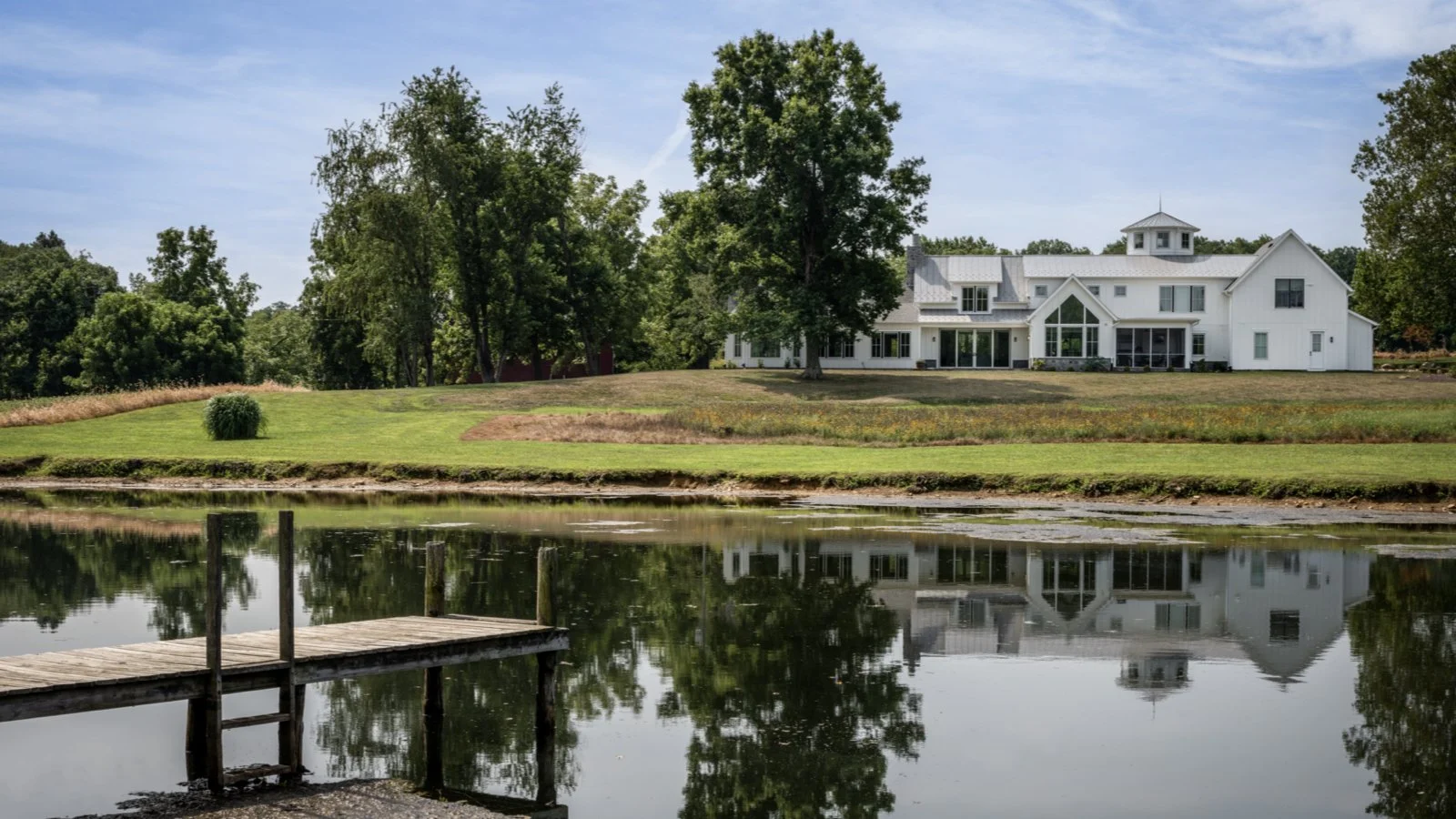‎the-rappahannock-river-company__maryland-west-friendship__homes__silo-modern-barnhouse__exterior-lake.jpeg