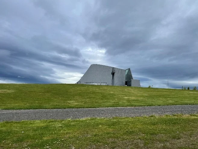 modern-grey-church-grassy-hill-iceland-2026.jpeg