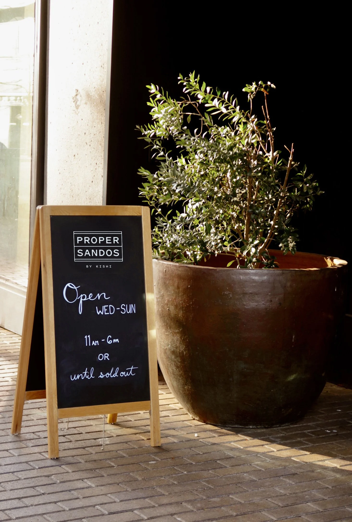 Proper Sandos' signage