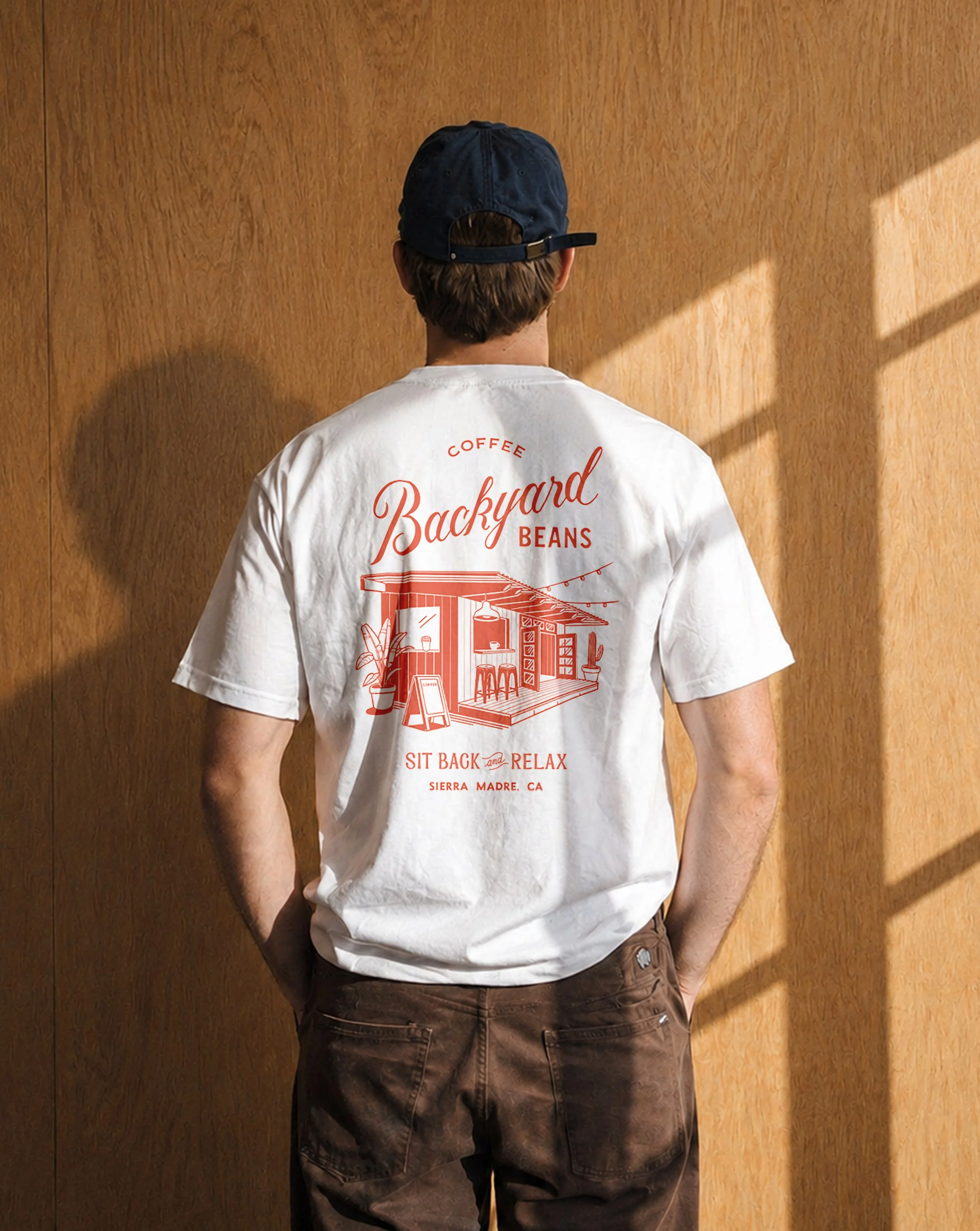 Custom apparel t-shirts design featuring vintage inspired exterior illustration for Backyard Beans Coffee brand identity.