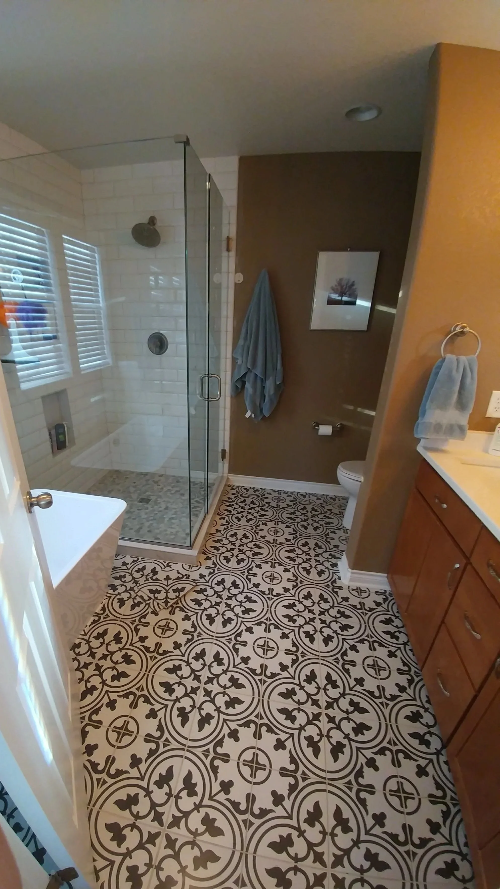 Master bathroom with encaustic cement tile floor and mosaic shower pan and subway tile in Central Park, Denver.
